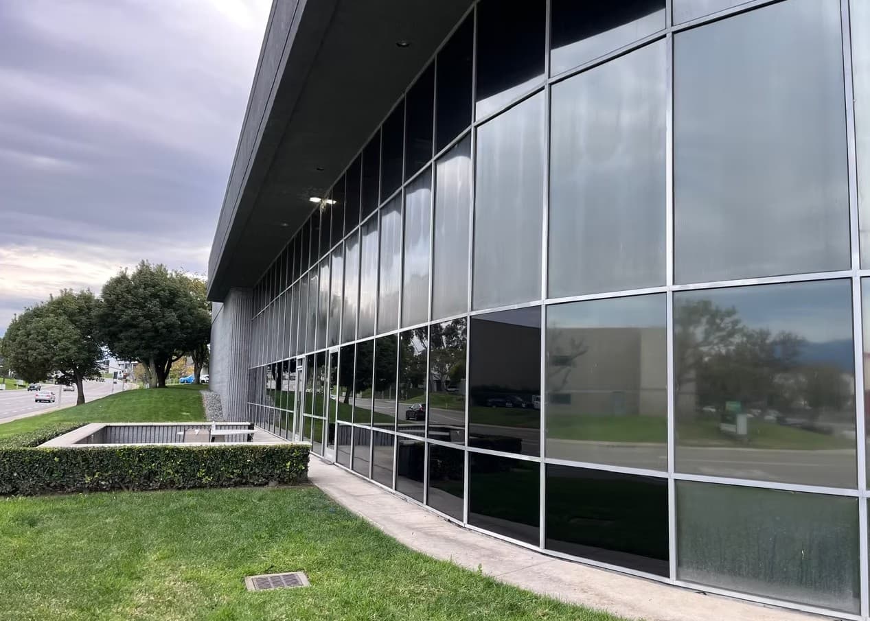 Modern commercial space featuring RMC Tints architectural film and signage